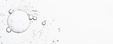 The texture of a cosmetic serum with bubbles in closeup. Copy space