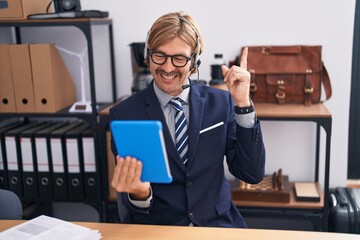 Poster - Caucasian man with mustache wearing call center agent headset smiling happy pointing with hand and finger to the side