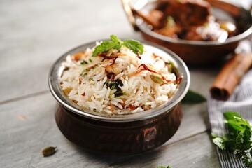 Wall Mural - Malabar Ghee Rice or Nei choru with chicken curry, selective focus