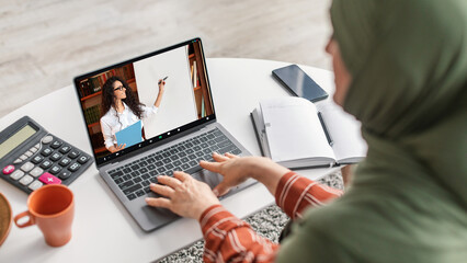 Poster - Webinar Concept. Muslim Woman Watching Educational Videos On Laptop