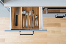 wooden cutlery drawer in kitchen, top view