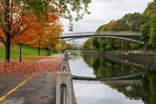 Fall Foliage In Ottawa, Ontario, Canada. Rideau Canal Eastern Pathway Autumn Red Leaves Scenery. The Corktown Footbridge.