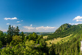 Fototapeta Lawenda - A small village with fields under a blue sky in Munich, Germany