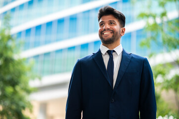 Wall Mural - Young businessman outdoor in a modern setting