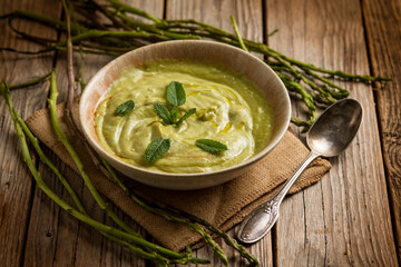 Wall Mural - asparagus soup with mint leaf