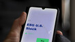 © maurice norbert - September 13th 2022, London UK. An investor's analyzing the ESG US stock etf fund on screen. A phone shows the american ESG ETF's prices  to invest