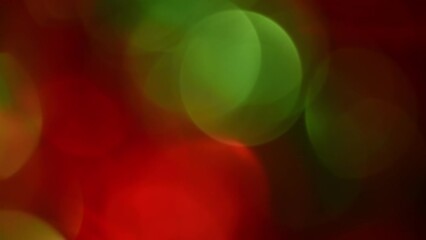Wall Mural - Christmas bokeh smooth movement. Red and Green defocused circles shimmer, shine and sparkle. Can be used as background, overlay or screen for apps. Relaxing New Year's lights motion.