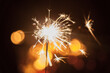 © Austockphoto - Sparkler shining in the darkness on a bonfire night