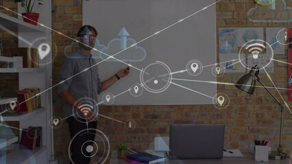 Poster - Animation of network of connections and cloud icons over caucasian male teacher