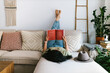 © ADDICTIVE STOCK - Woman reading a book at home