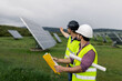 © ADDICTIVE STOCK - Male engineers discussing solar power plant construction