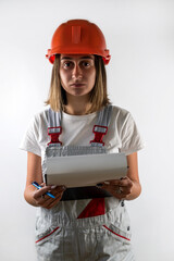 Wall Mural - young woman in uniform and helmet with paper in hands isolated on white background.