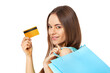 © Dmytro Panchenko - Happy beautiful woman with shopping bags and credit card isolated on white.