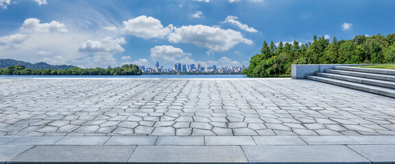 Empty city square and green forest with city skyline scenery in Hangzhou, China.