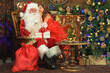 © aletia2011 - Portrait of Santa Claus and happy girl with gift  by Christmas tree