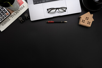 Fototapete - Flat lay of top view desk work table with house model computer laptop and financial newspapaer in Real estate market concept includes copyspace for add text or graphic