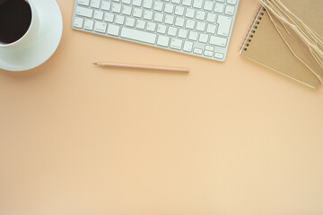 Fototapete - Flat lay of top view desk work table with Coffee computer notebook and pencil work space in minimal orange color autumn tone concept includes copyspace for add text or graphic