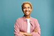 © Anatoliy Karlyuk - Portrait of pretty black girl of 20s looking up smiling biting lips, planning something, remembering funny moments, thinking about her boyfriend, standing with crossed hands on blue background