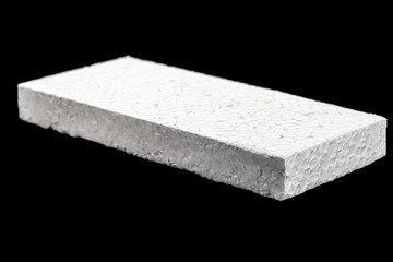 styrofoam board isolated on black background, non-toxic polystyrene material, thermoplastic and flexible resin, used in the transport, construction and food preservation industry