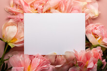 Empty Open Notebook For Writing Dreams And Wishes. Beautiful Pink Peonies And Petals Nearby As A Frame. Light Pink Background With Copy Space For Text. Card Concept