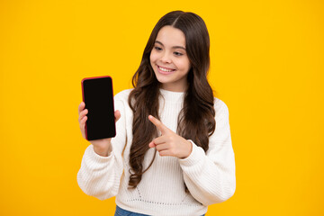 Teenager child using mobile phone, chatting on web. Mobile app for smartphone. Children lifestyle concept. Kid showing blank screen mobile phone, mockup copyspace.