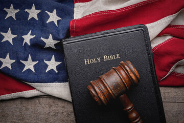 Sticker - Holy Bible and Gavel resting on an vintage American flag with a rustic wooden background