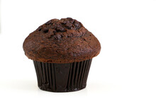 An Irresistible And Delicious Double Chocolate Chip Muffin Cake On Left Of Frame Isolated Against White Background