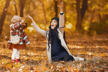 Wall Mural - Cute and stylish family in a autumn park