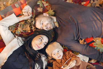 Wall Mural - Family with little daughter in a autumn park