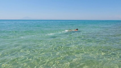 Wall Mural - Summer Vacation Activity Man Swimming Snorkeling In Beautiful Turquoise Color  Sea During Holiday.