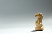 Wooden Knight On Light Background, Space For Text. Chess Piece