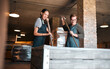 © Kirsten D/peopleimages.com - Wine making, production and cellar workers holding press tool to crush, blend and stir open tank for alcohol process. Vintner, factory and winery industry with distillery and manufacturing warehouse