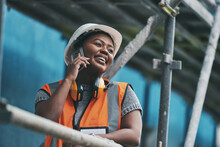 Construction Manager, Contractor And Engineer Talking On A Phone While Planning Logistics At A Building Site In Town. Happy, Smiling And Cheerful Young Female Architect, Supervisor And City Planner
