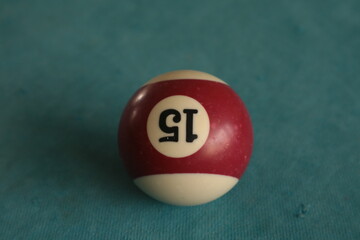 Close-up billiard ball. Billiards sports game on a green table. Active recreation and entertainment.