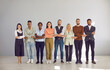 Portrait of diverse multiracial employees hold hands show team unity and integrity in office. Smiling multiethnic people feel united at workplace, involved in teambuilding. Business, teamwork.