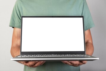 Poster - Man holding laptop mockup with empty screen. Male using computer for showing presentation for work, study. Report, new project, startup presenting.