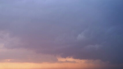 Wall Mural - Stormy sky at sunset with dark rain clouds. Rain over a summer landscape