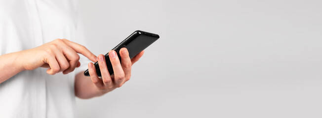 Poster - Banner with woman hand swiping phone screen. Female scrolling social media, looking through photos, news. Place for text