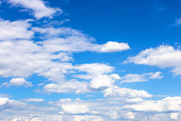 Wall Mural - white cumulus clouds in blue sky on sunny day