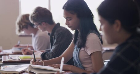 Aufkleber - School girl writing in book in classroom, student learning for education at table and studying for exam in notebook in class. Children doing exam on paper, creative test at desk and focus on study