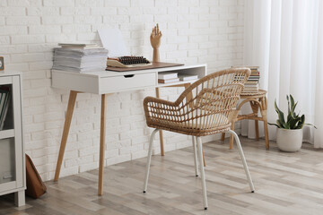 Sticker - Comfortable writer's workplace interior with typewriter on desk near white brick wall