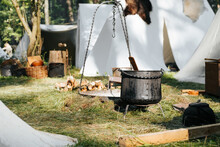 Tent Medieval Camp In Forest, Cauldron, Outdoor Fire Place On Sunny Summer Day