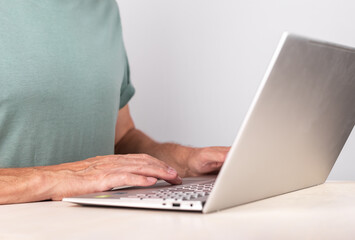 Poster - Man hands closeup typing on laptop keyboard. Using computer for work, study, relax. Male preparing project, report, writing e-mail or surfing Internet.