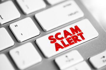 Fototapete - Scam Alert text button on keyboard, concept background