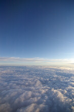 A View Of Clouds Below From A High Altitude Aircraft