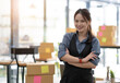 © wichayada - Young attractive asian woman owner startup business look at camera work happy with box at home prepare parcel delivery in sme supply chain