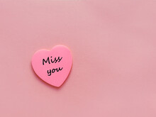 Miss You  Written On  Pink Sticky Note In  Heart  Shape  