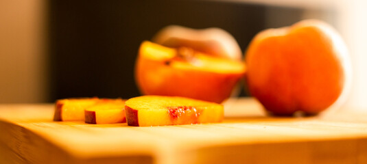 Wall Mural - Ripe peaches on wooden board close up