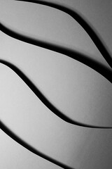 Poster - carbon grey abstract geometric background with soar horizontal curved waves in hard light with black