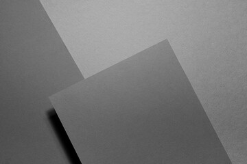 Poster - carbon grey abstract geometric background with fly inclined rectangle surface in hard light, shadows